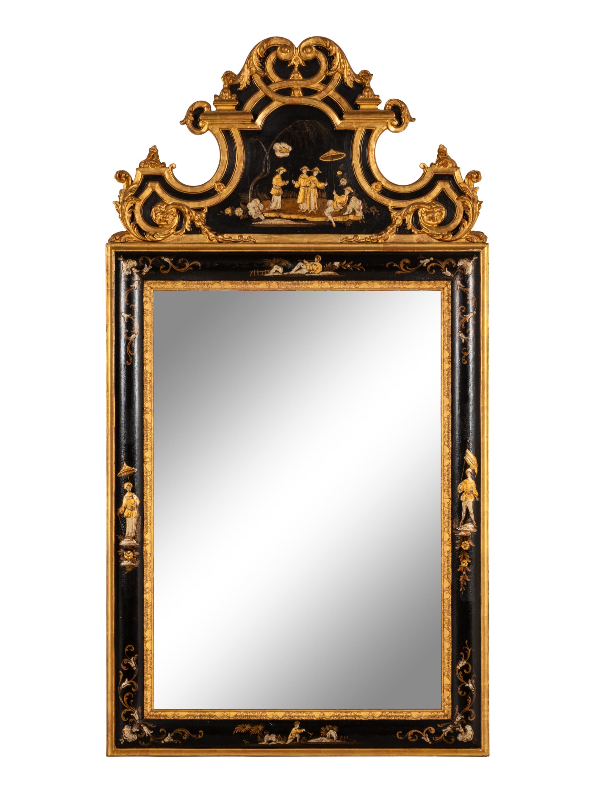 A Régence Style Chinoiserie Ebonized and Giltwood Mirror