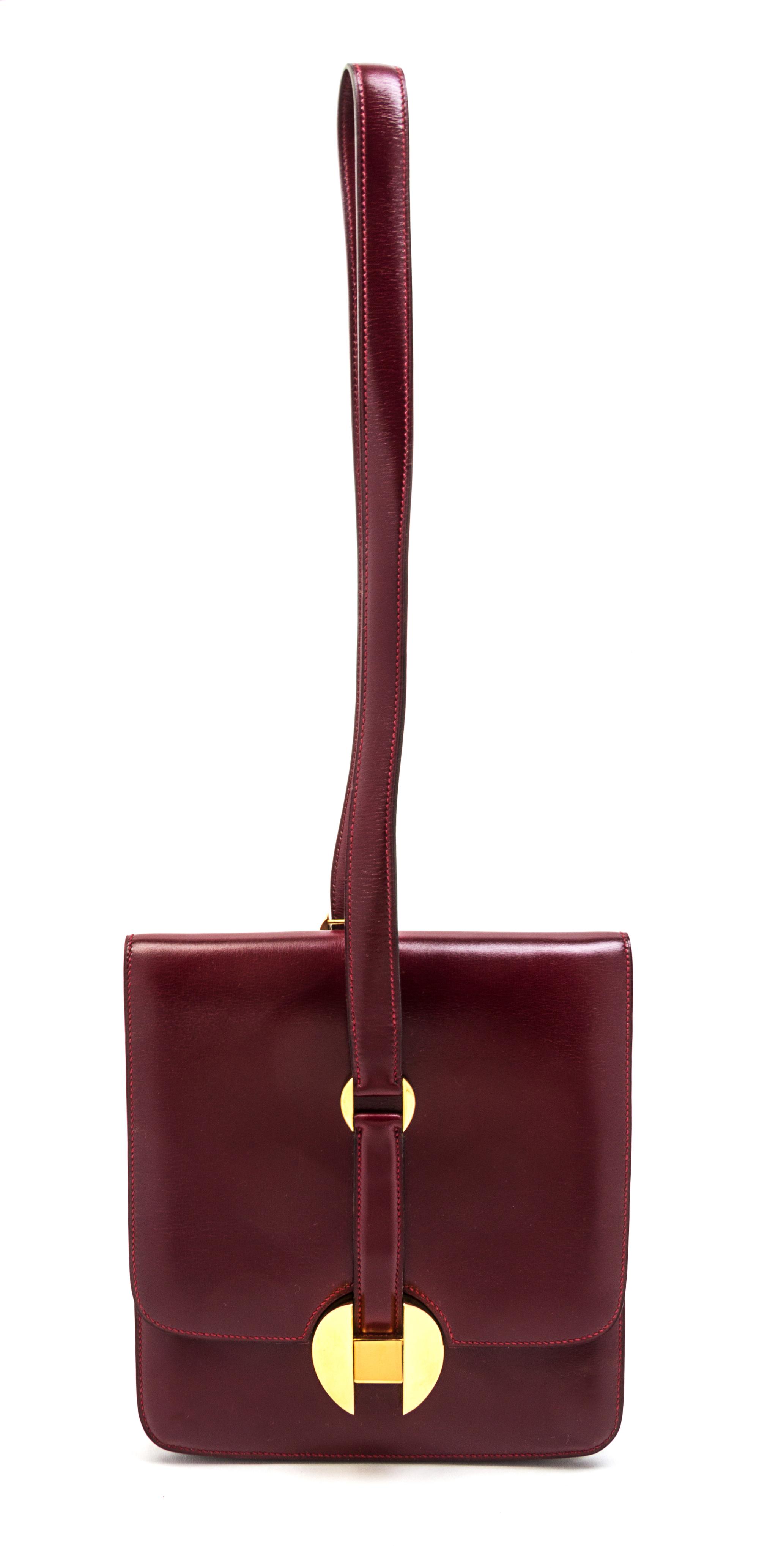 An Hermes Rouge Leather Shoulder Bag, 9 x 8 x 1 inches.