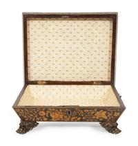 A Regency Black and Gilt Lacquer Box on Brass Paw Feet