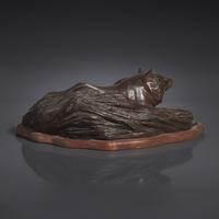 A Japanese Patinated Bronze Figure of a Tanuki in Grasses, Meiji/Taisho Period, The Maruki Co., Tokyo — 日本明治/大正時代 “丸喜製銅”銅狸貓置物