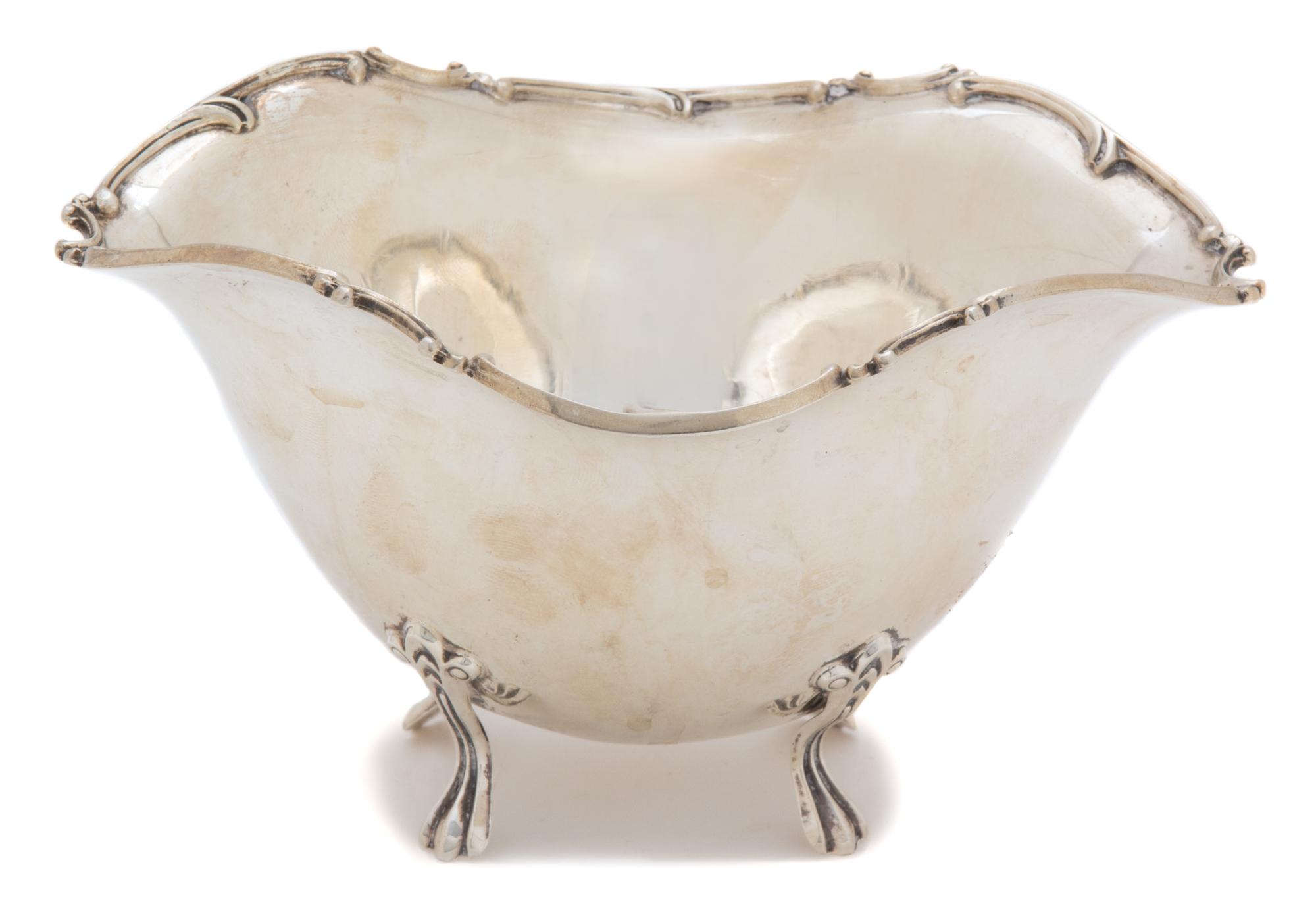 An American Silver Oval Footed Bowl, Unknown Maker, having a scrolled border