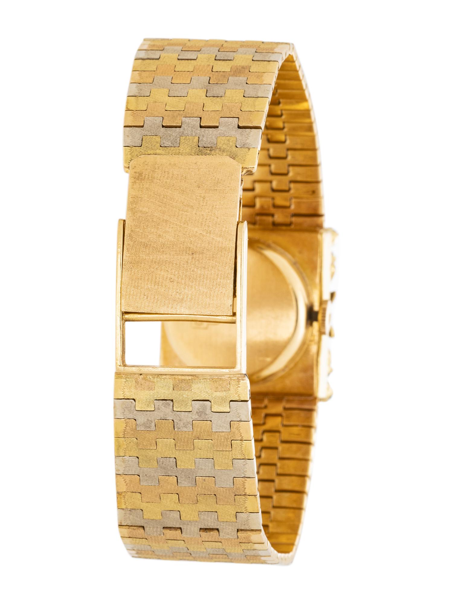 TRICOLOR GOLD AND EMERALD SURPRISE WATCH