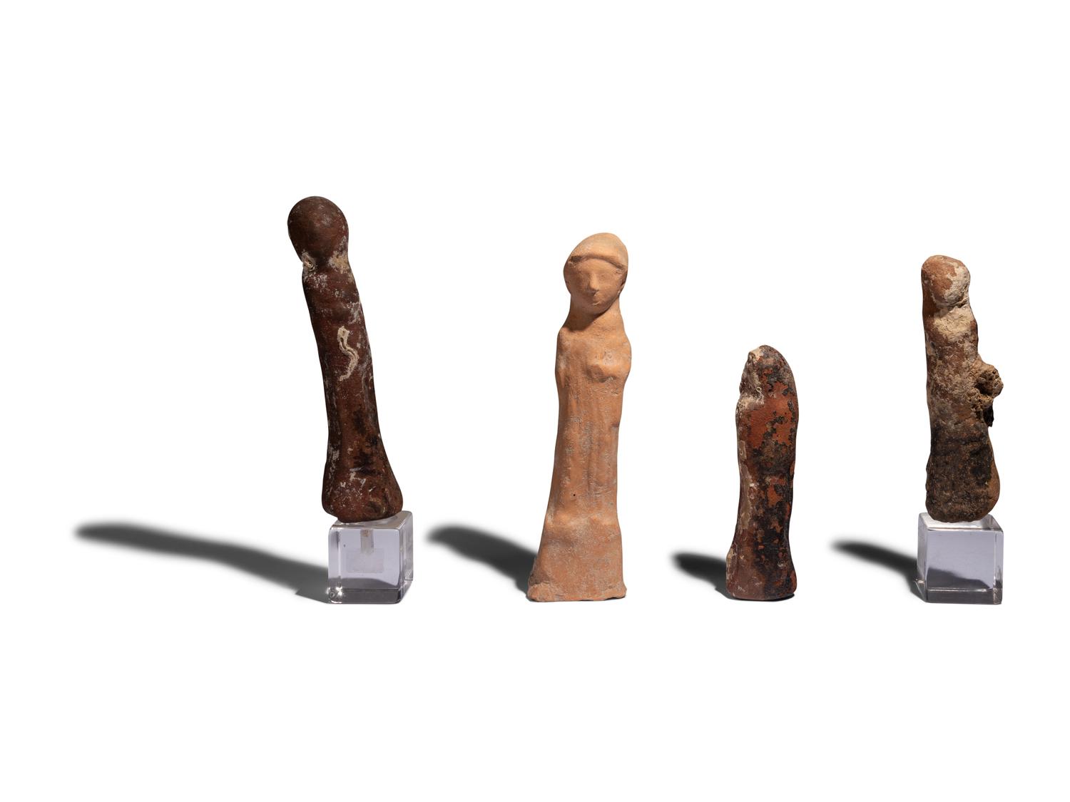 Four Near Eastern Stone and Terracotta Figures of Tanit