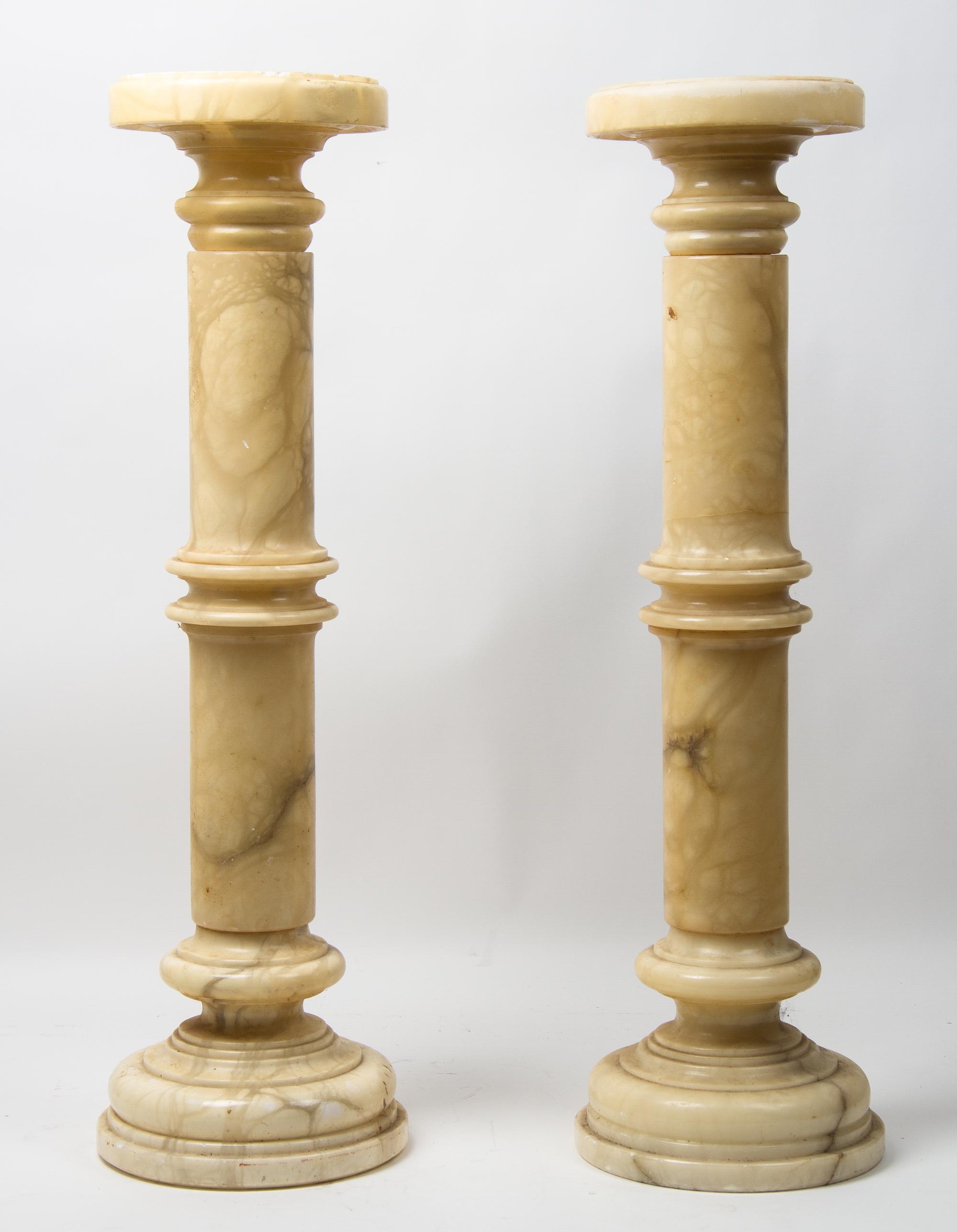 A Pair of Stone Pedestals Height 34 inches.