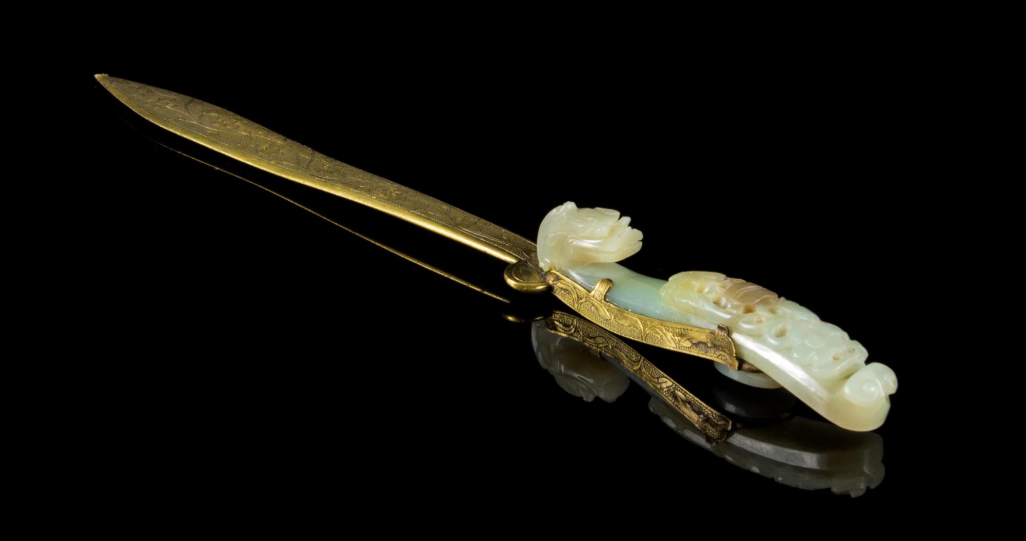 A Carved Celadon Jade Belt Hook