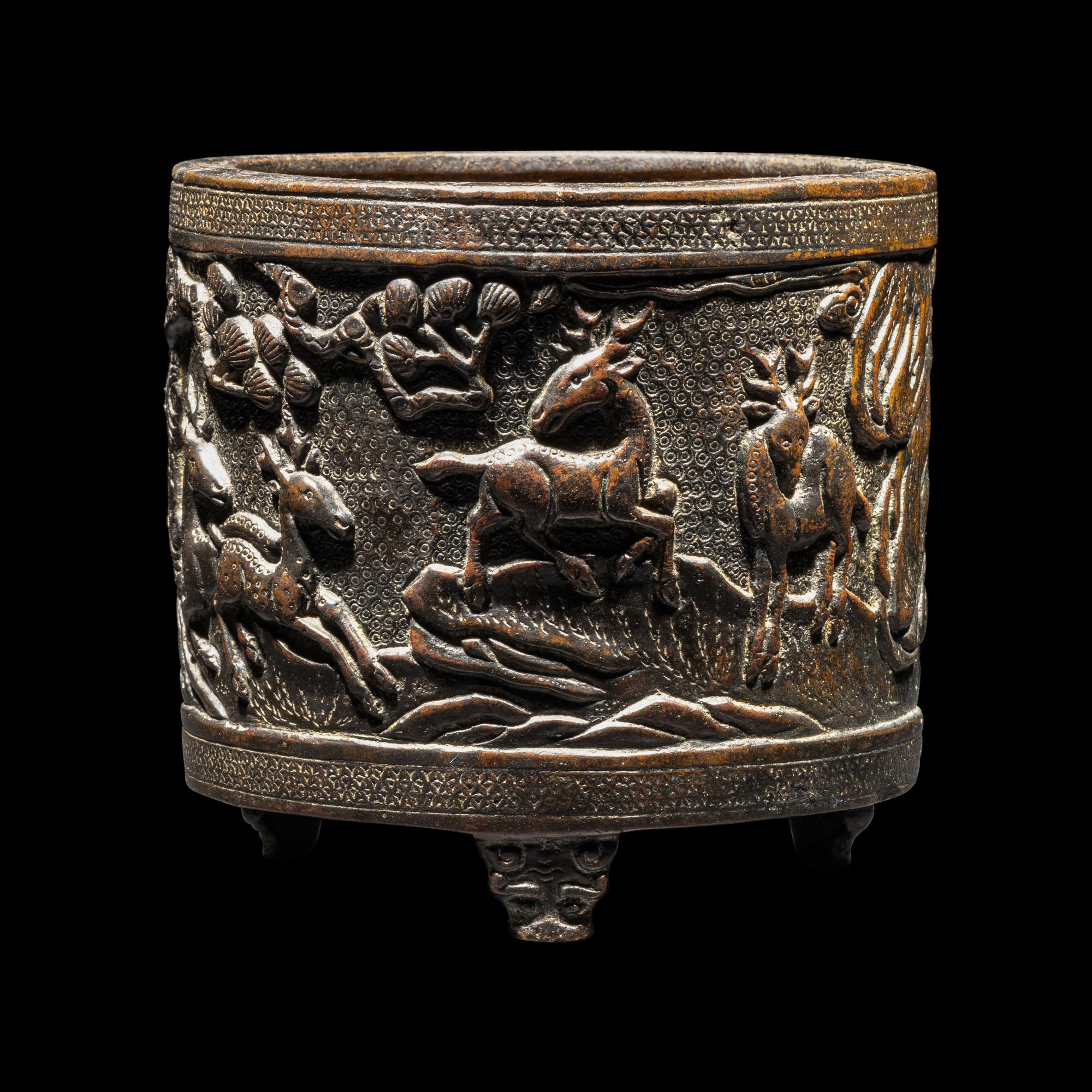 A Chinese Bronze 'Pine and Deer' Incense Burner 銅松鹿圖三足爐