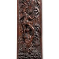 An Italian Carved Walnut Mantelpiece