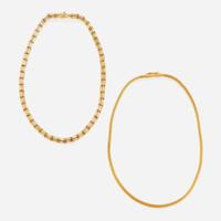 Two eighteen karat gold chains