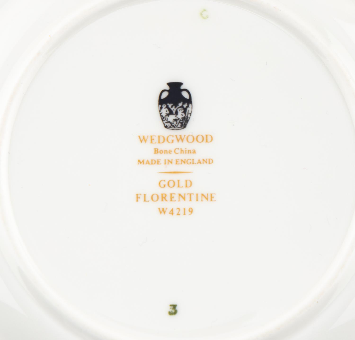 A Wedgwood Gold Florentine Porcelain Dinner Service