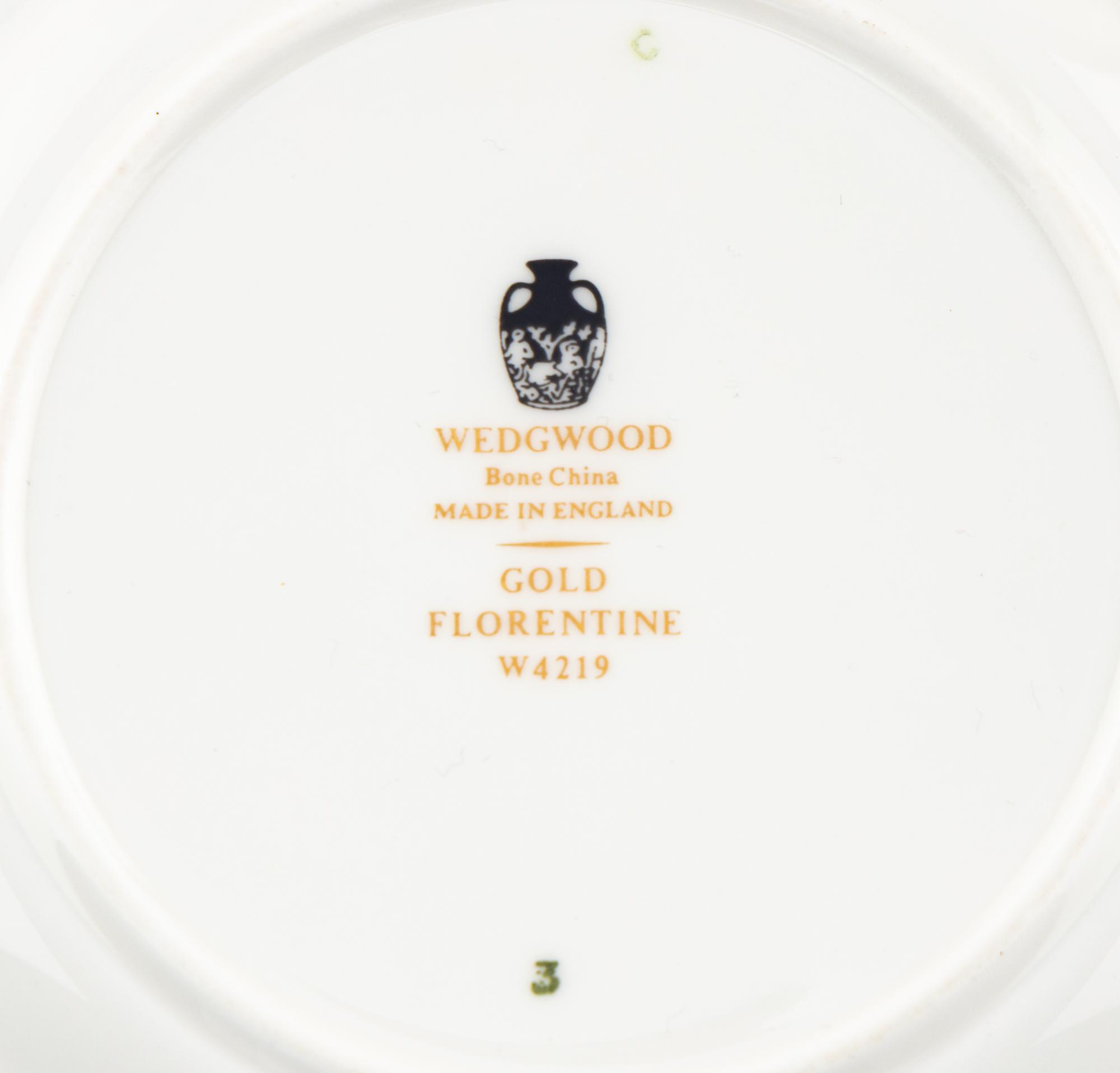 A Wedgwood Gold Florentine Porcelain Dinner Service