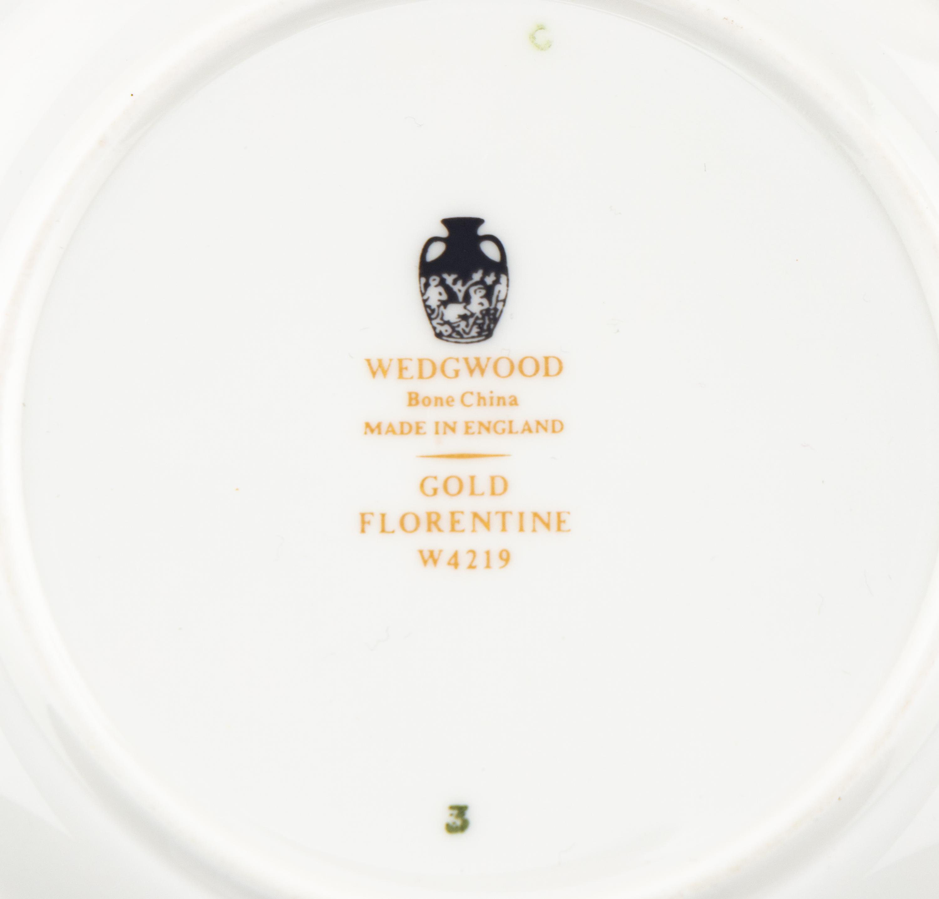 A Wedgwood Gold Florentine Porcelain Dinner Service
