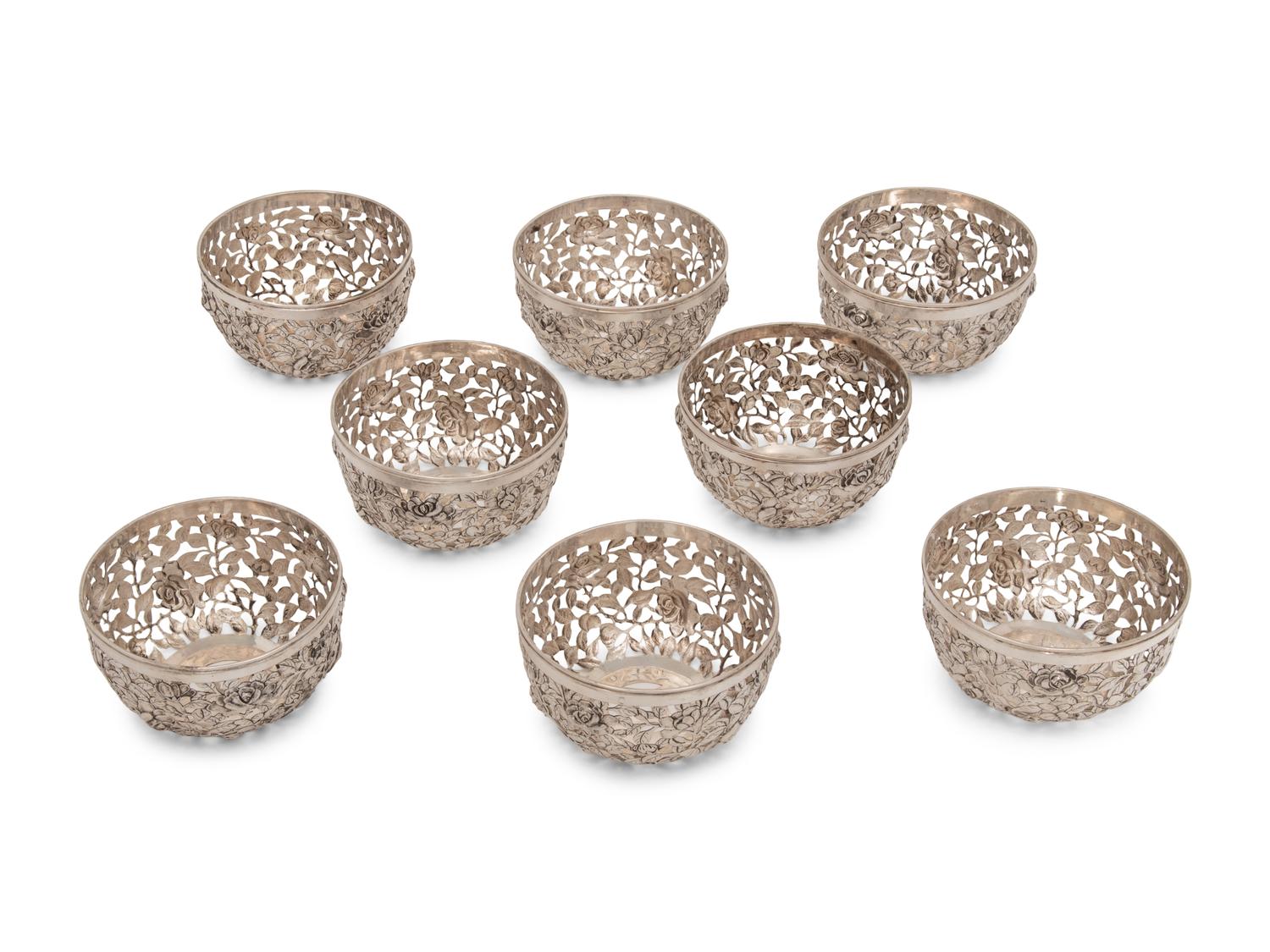 A Set of Eight Chinese Export Pierced Silver Bowl Liners