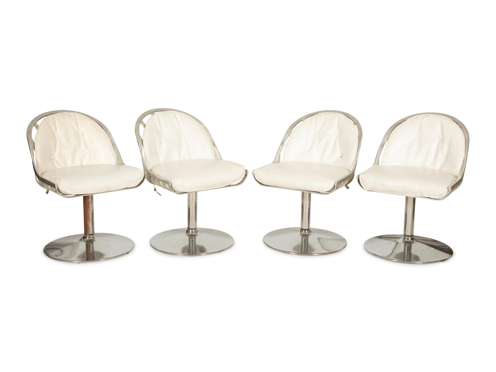 A Russell Woodard Dining Table with Four Chairs