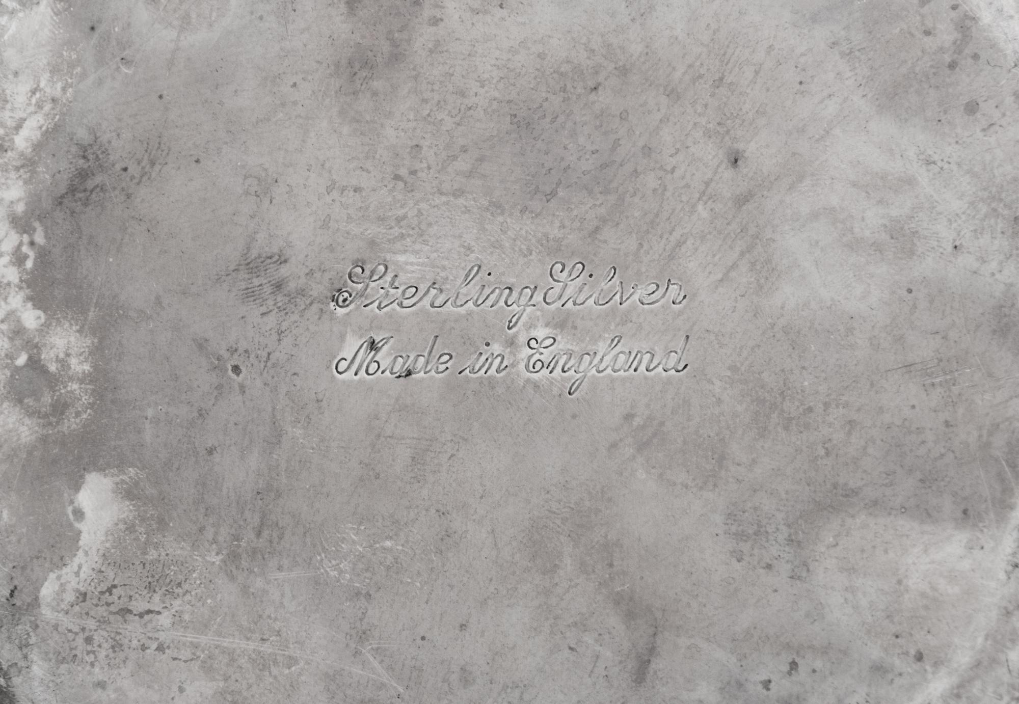 A Collection of Eight English Silver Table Articles