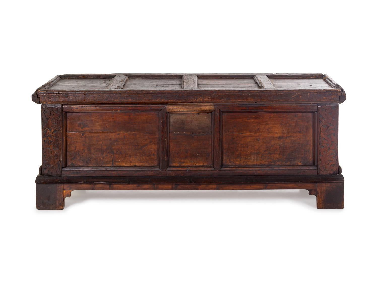 A German Carved and Paneled Walnut Kast