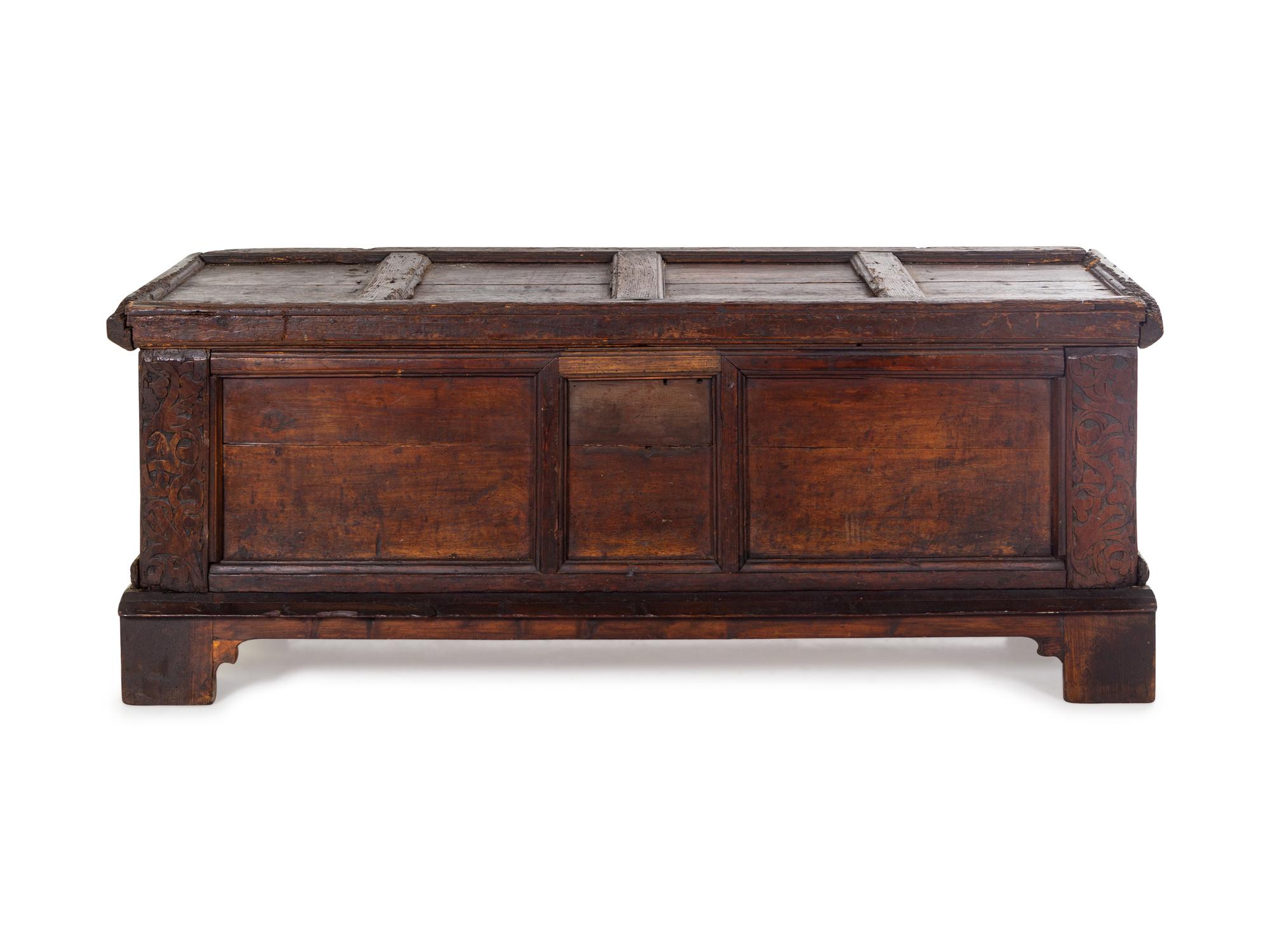 A German Carved and Paneled Walnut Kast