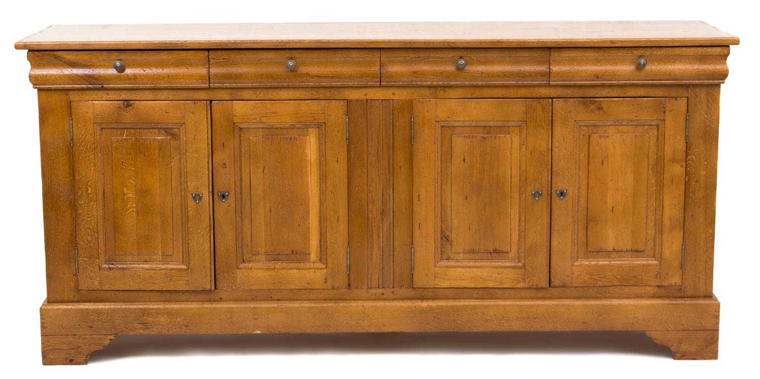 A French Provincial Carved Elm Sideboard Height 40 1/2 x width 86 1/2 x depth 21 1/2 inches. — 19TH CENTURY