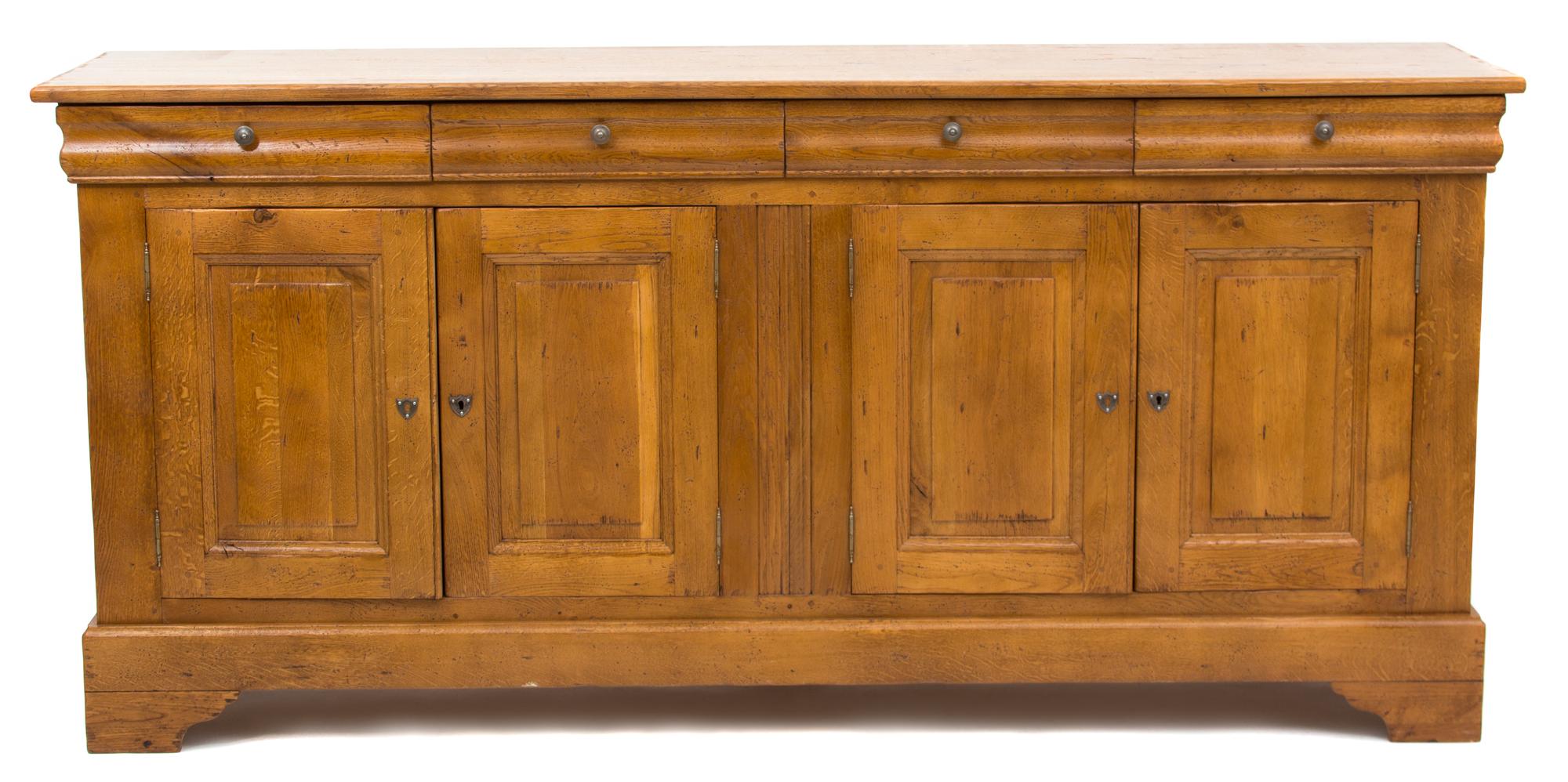 A French Provincial Carved Elm Sideboard Height 40 1/2 x width 86 1/2 x depth 21 1/2 inches. — 19TH CENTURY
