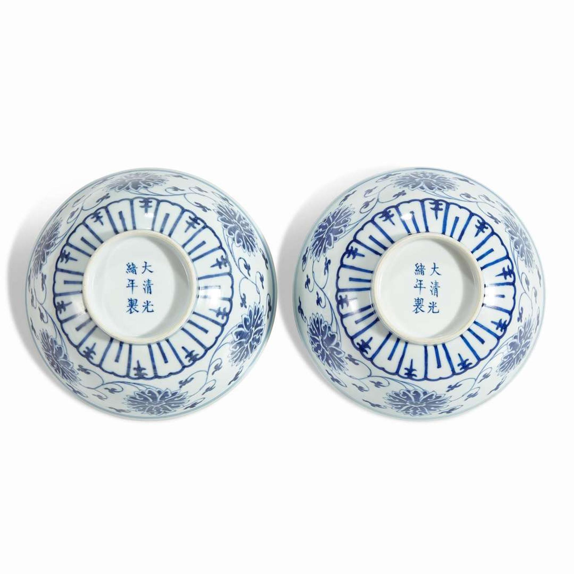 An associated pair of Chinese blue and white porcelain "Lotus" bowls Guangxu six-character marks