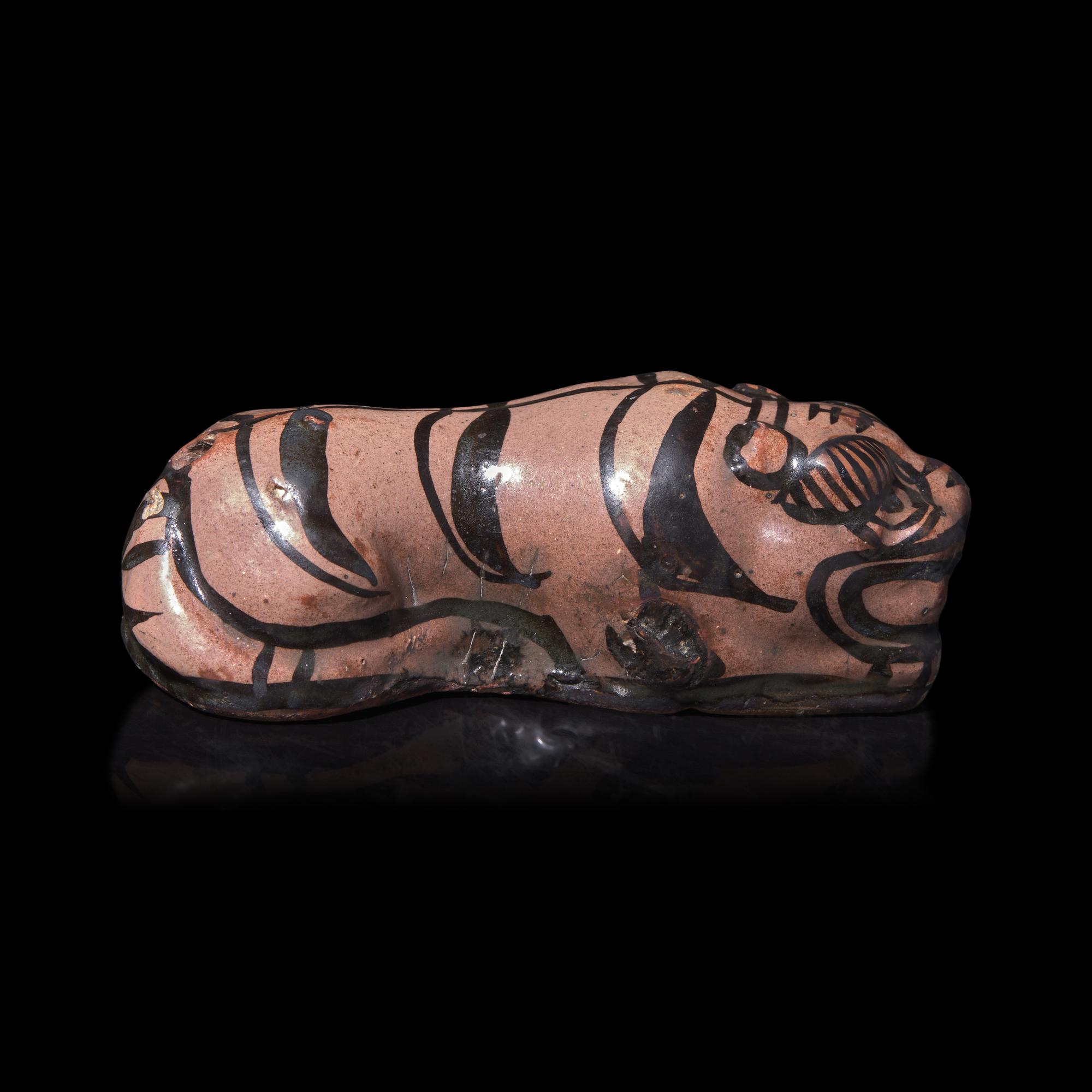 A Chinese Cizhou Glazed Figure of a Tiger 磁州窯臥虎形擺件