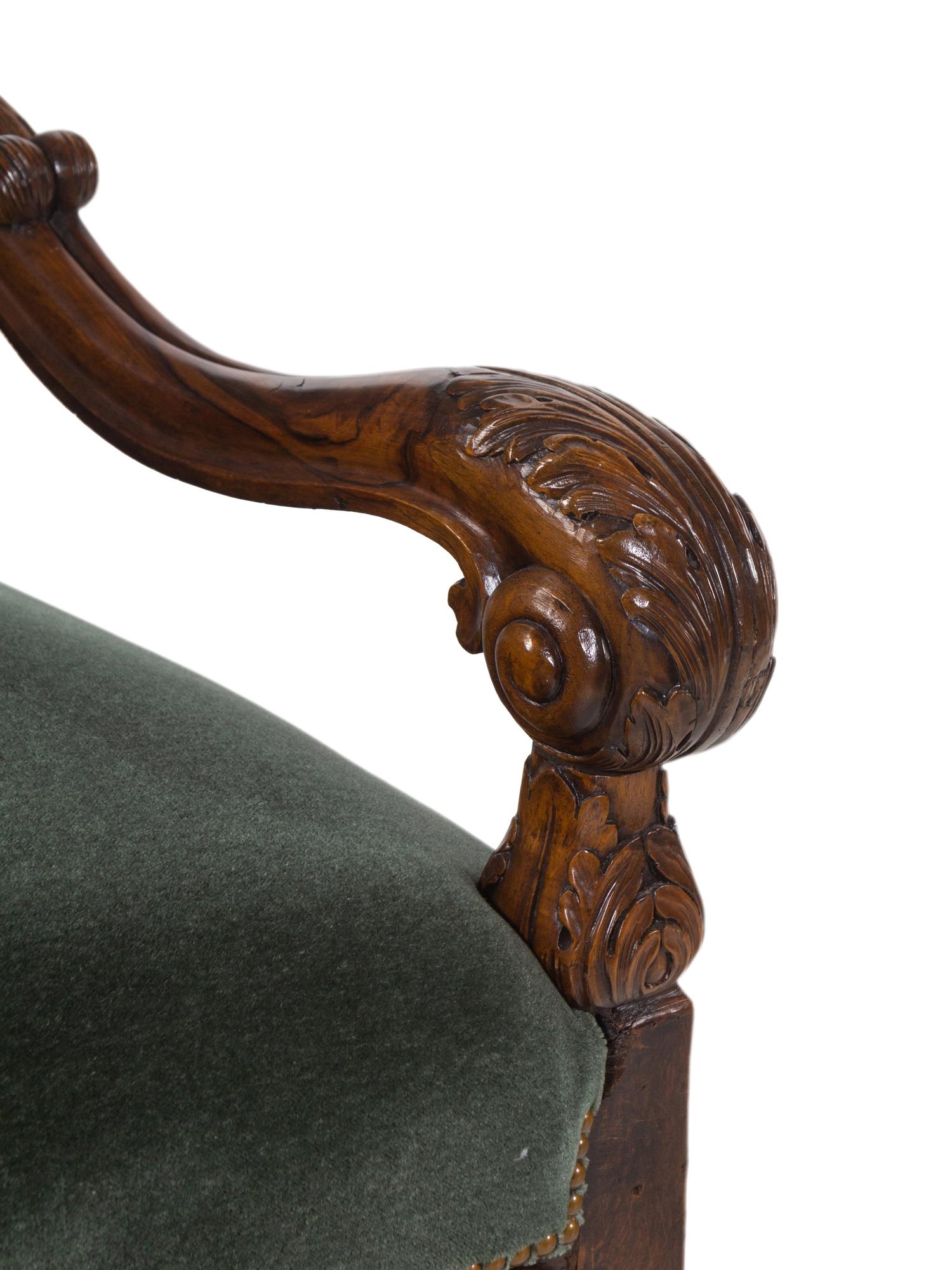 A Henri II Style Carved Walnut Armchair with Green Leather and Mohair Upholstery
