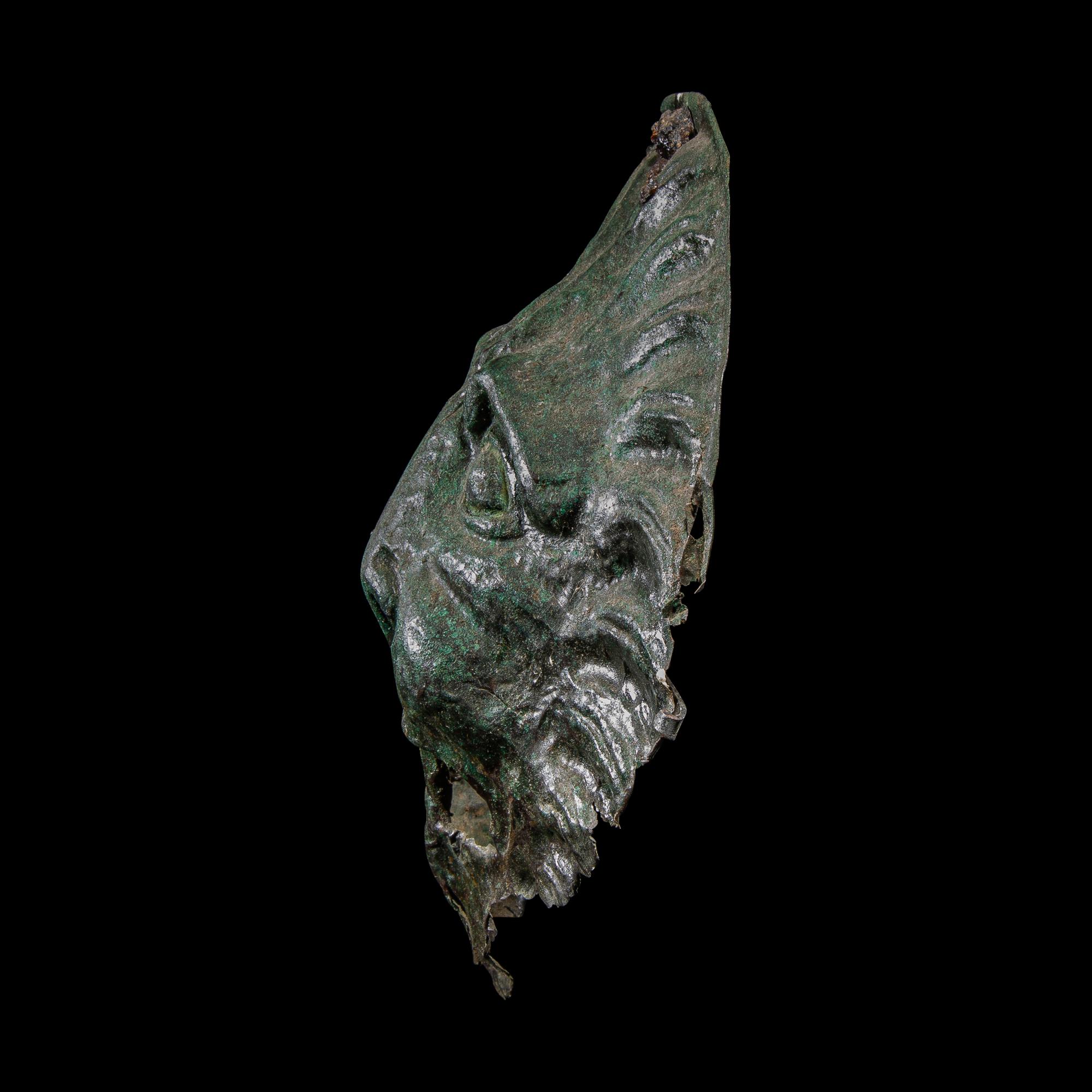 A Roman Bronze Sarcophagus Mask in the form of a Lion