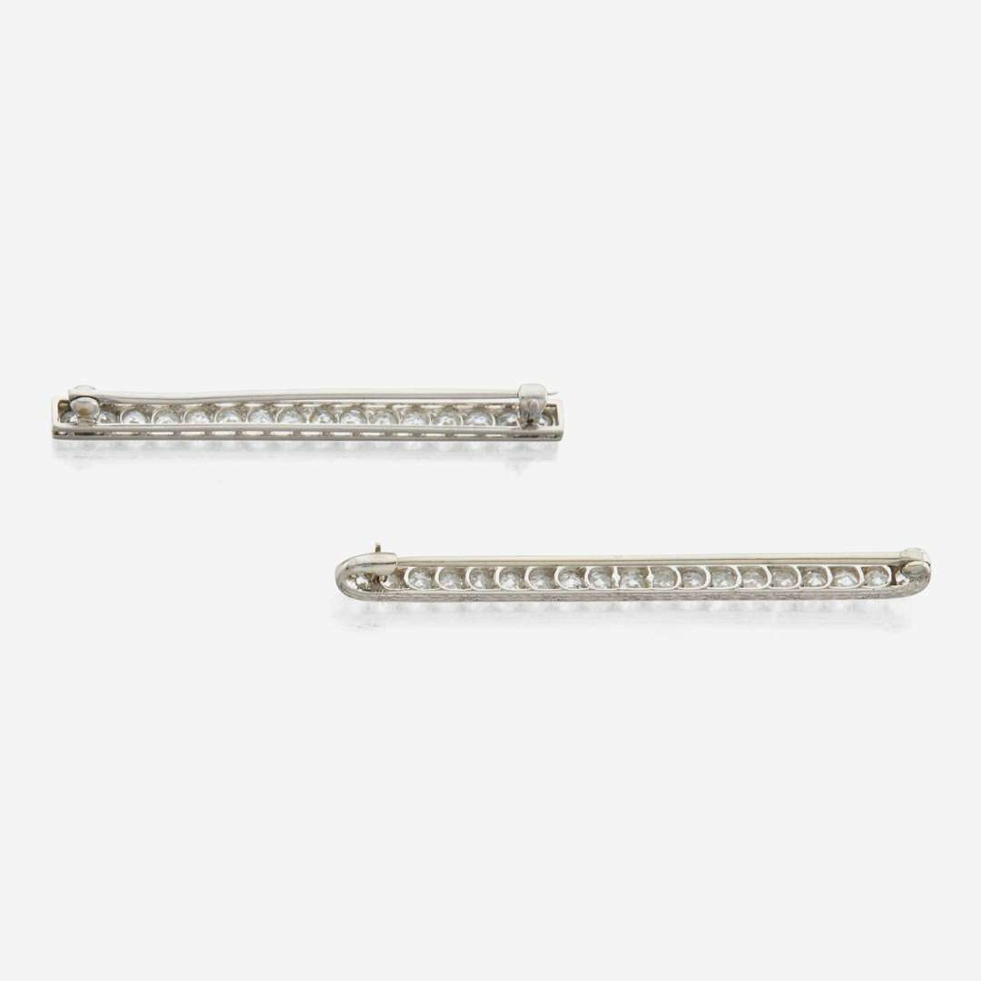 Two diamond and platinum brooches