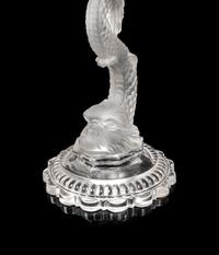 A Set of Four Baccarat Dauphin Three-Light Candelabra