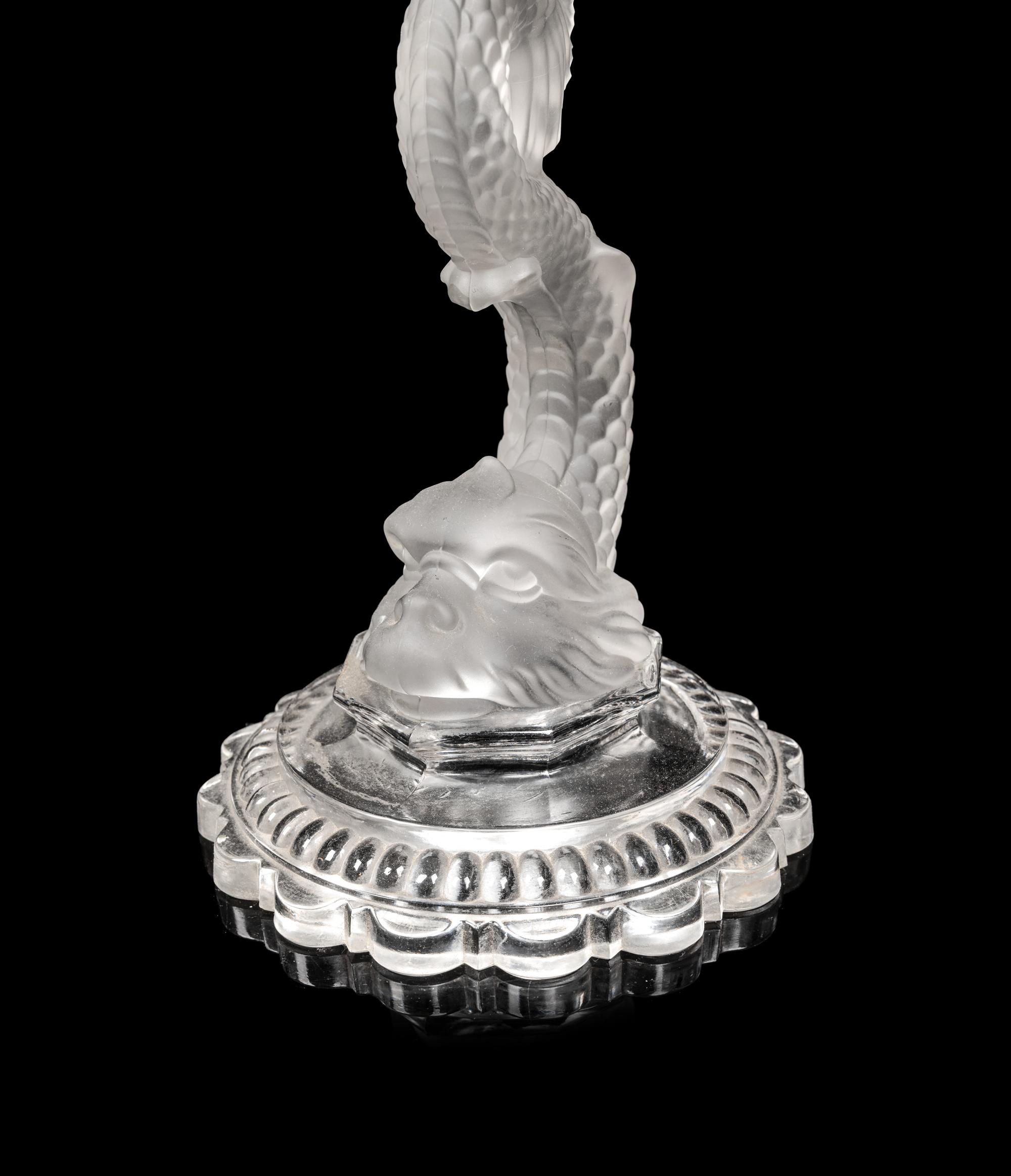 A Set of Four Baccarat Dauphin Three-Light Candelabra