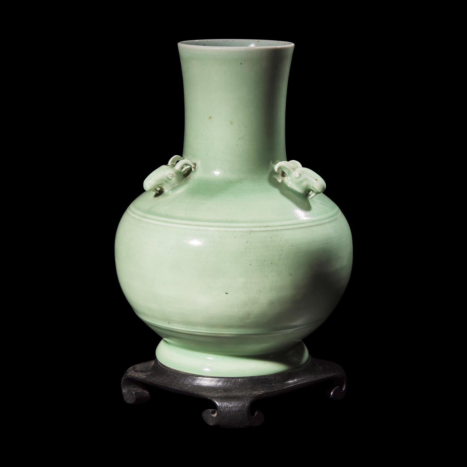A Chinese Celadon Glazed Porcelain 'Three Rams' Vase, Late Qing Dynasty 清晚期 粉青釉三羊弦紋尊