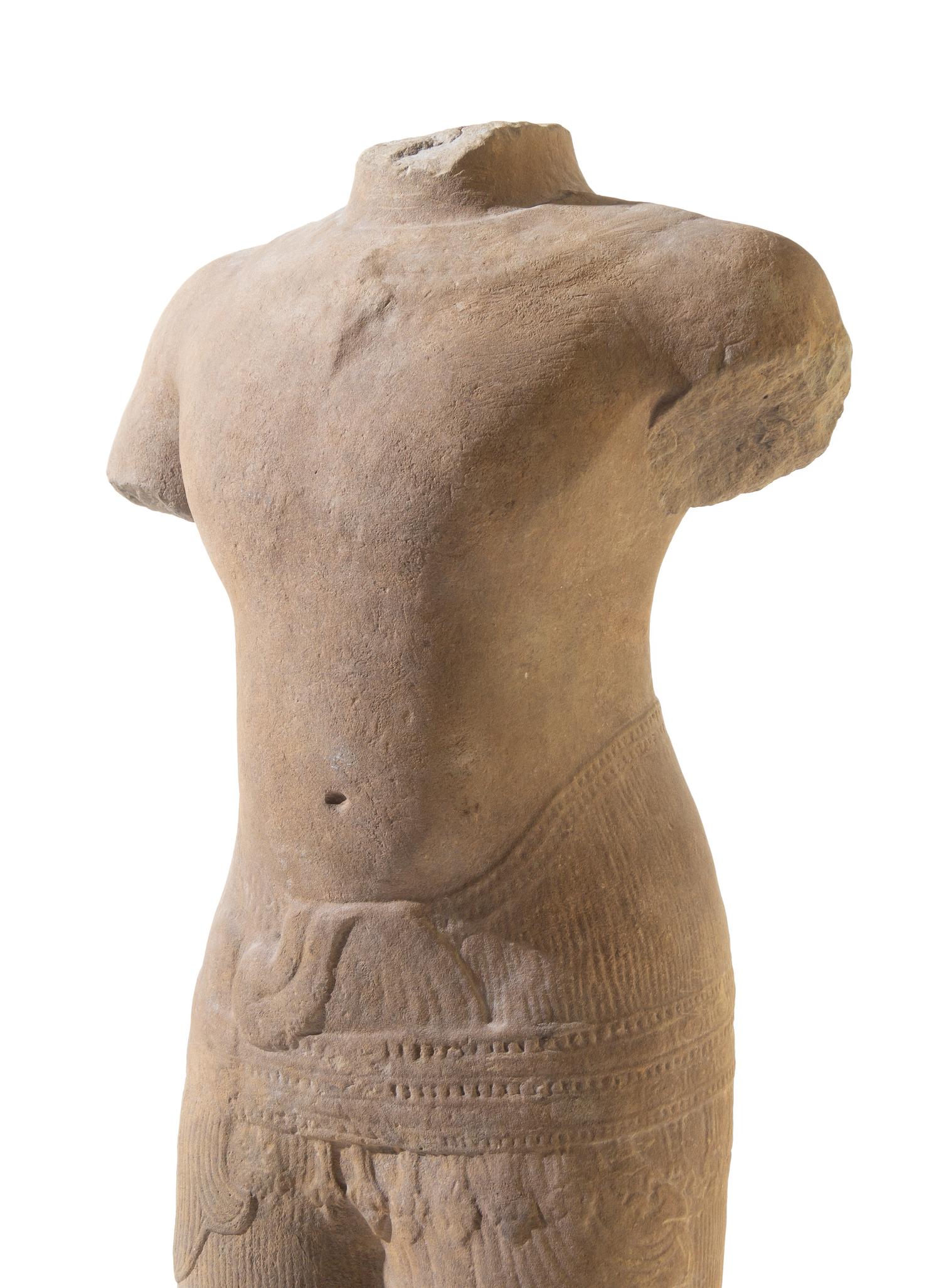 A Khmer Baphuon-Style Limestone Torso of Vishnu Height 43 inches. — ANGKOR WAT STYLE, 11TH CENTURY