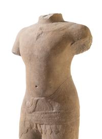 A Khmer Baphuon-Style Limestone Torso of Vishnu Height 43 inches. — ANGKOR WAT STYLE, 11TH CENTURY