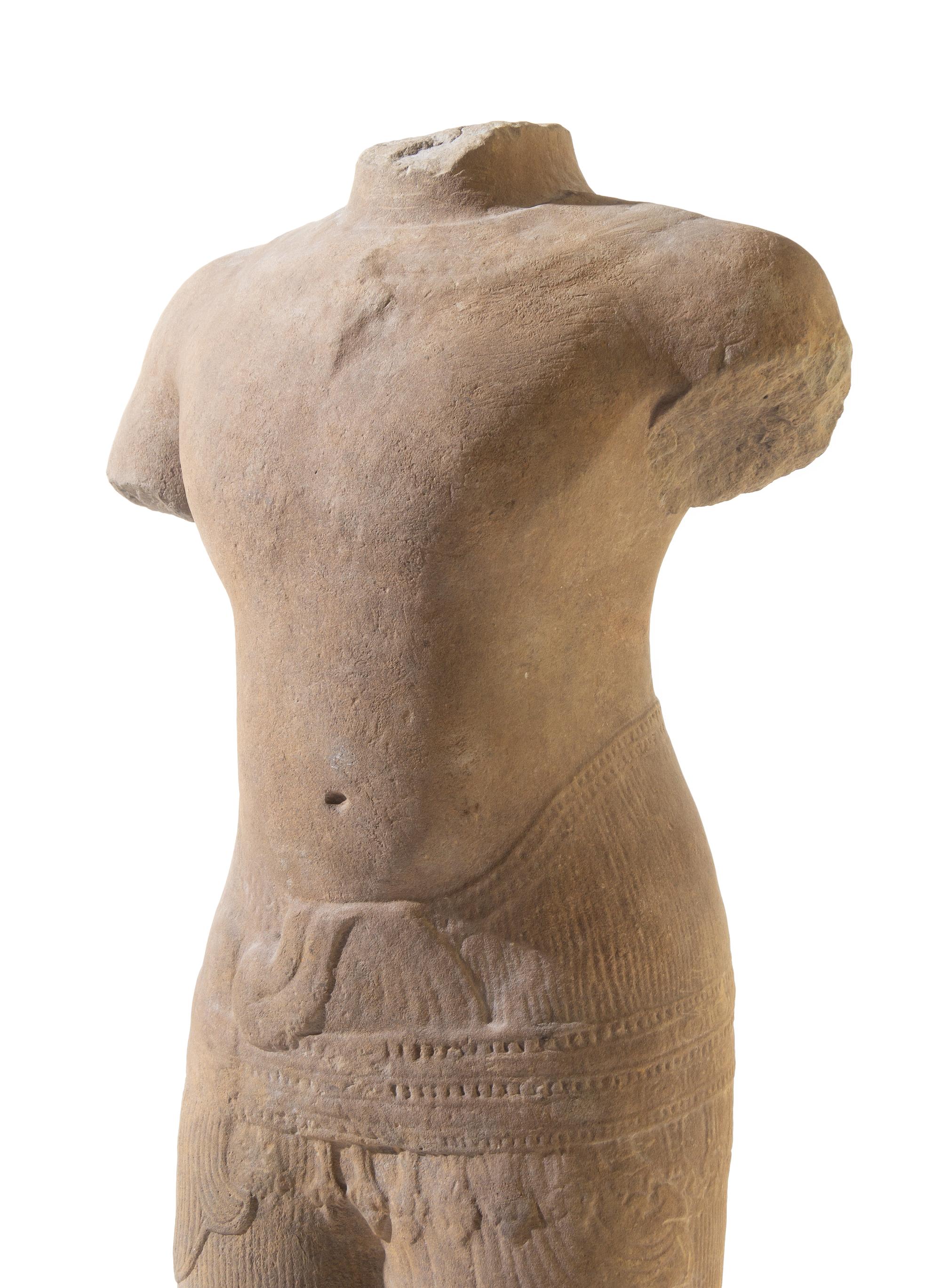 A Khmer Baphuon-Style Limestone Torso of Vishnu Height 43 inches. — ANGKOR WAT STYLE, 11TH CENTURY