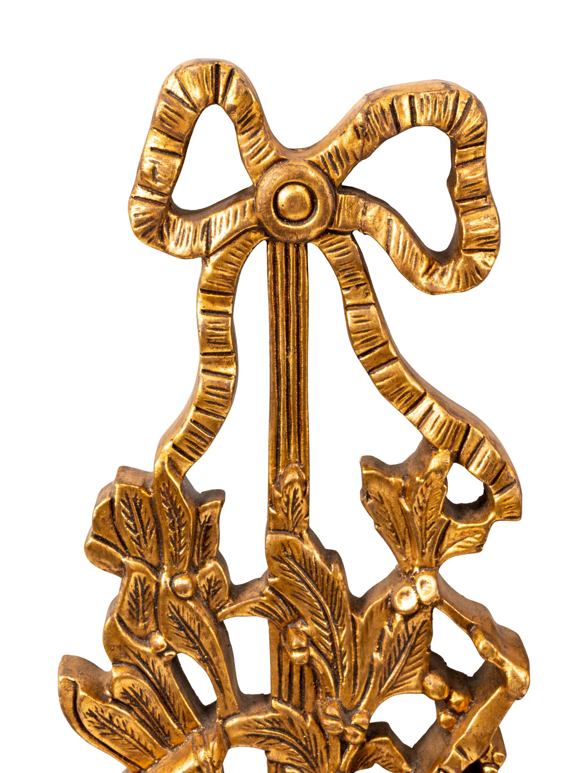A Set of Four French Giltwood Trophy Appliqués