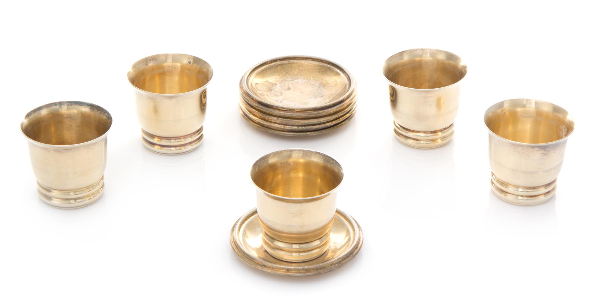 A Set of Five French Silver Cordial Cups and Underplates, Maker's Mark CA, each cylindrical body with a flared rim and a ribbed base, t