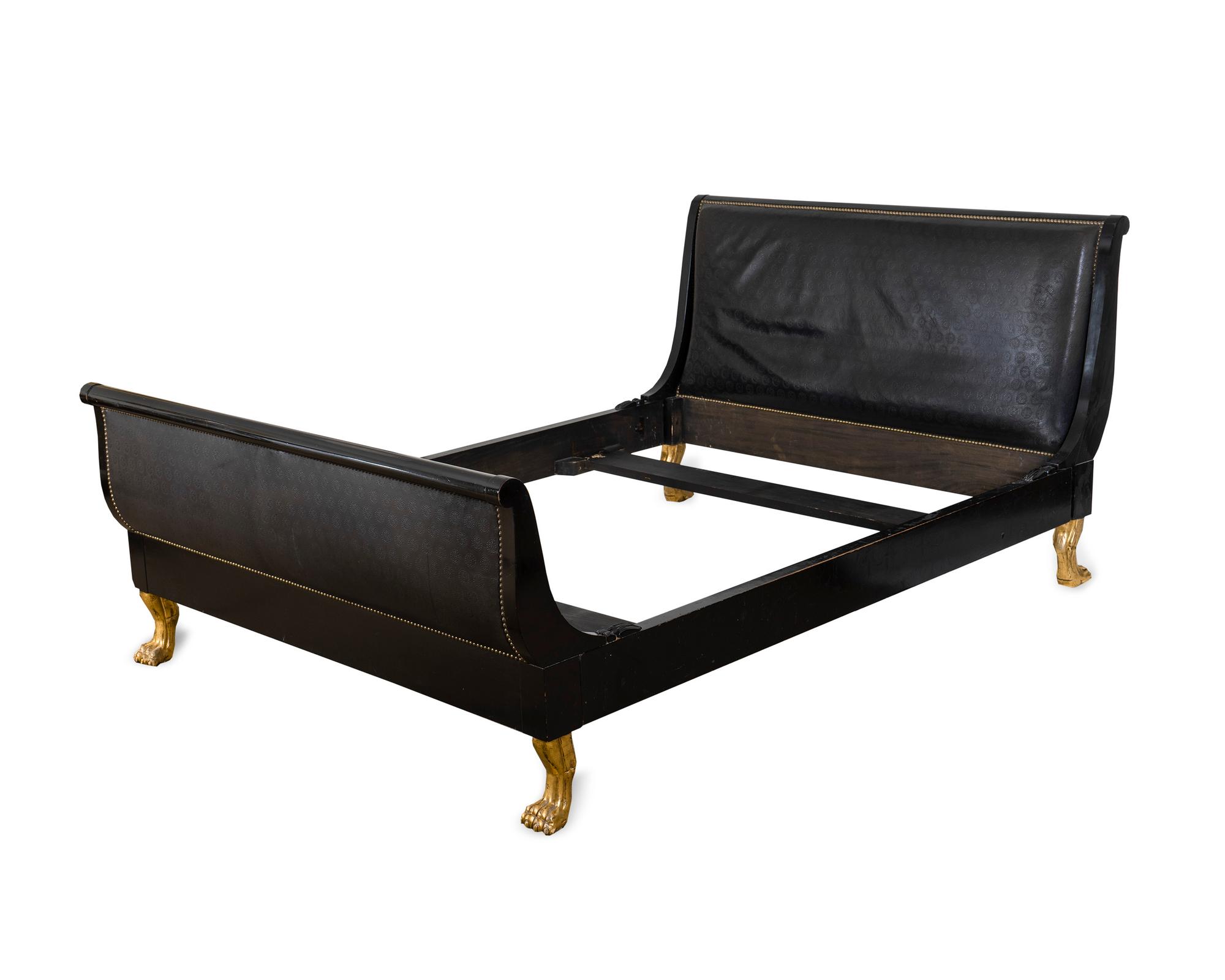 An Empire Style Ebonized and Gilt Wood Sleigh Bed — 20TH/21ST CENTURY