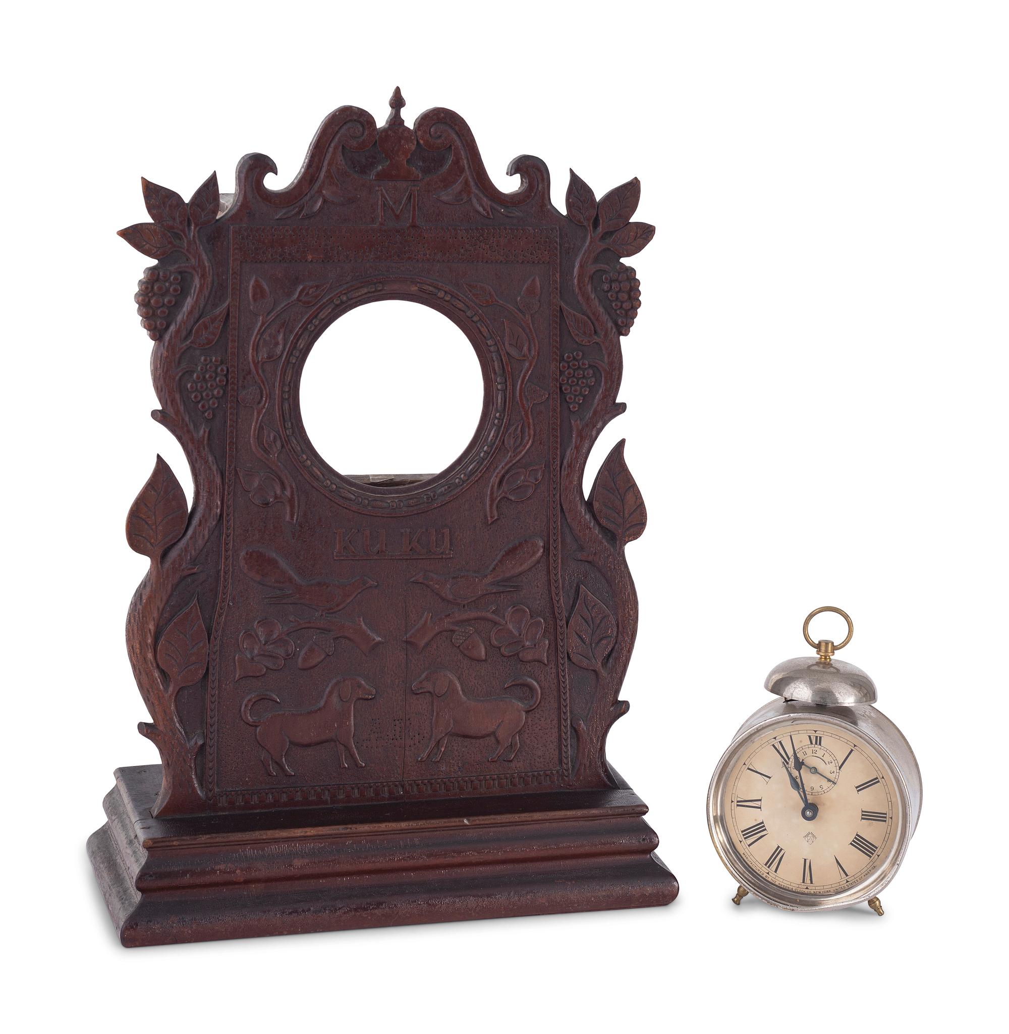 A Carved Walnut Folk Art Clock Hutch