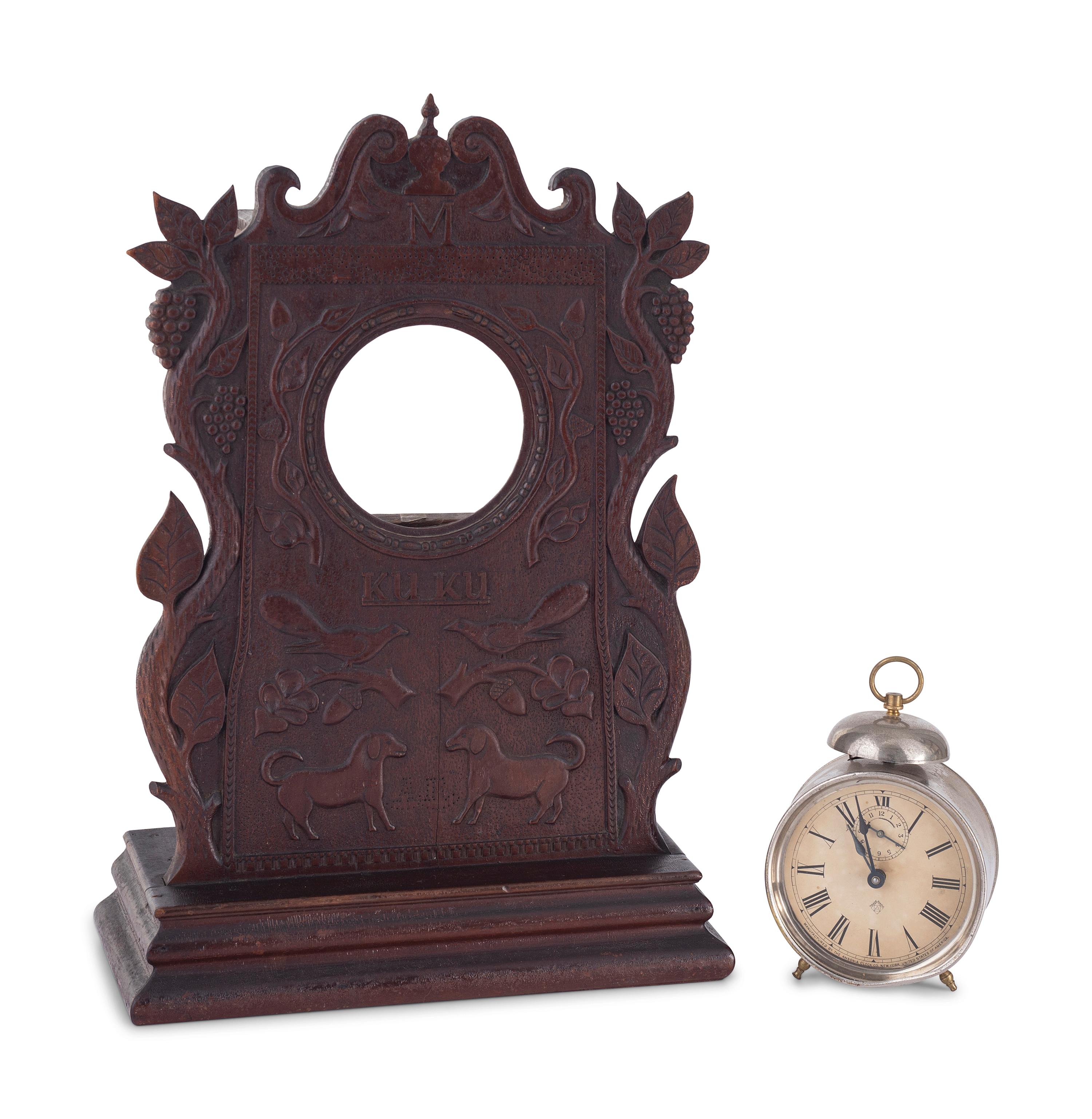 A Carved Walnut Folk Art Clock Hutch