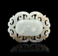 A Chinese Pale Celadon and Russet Jade Pendant