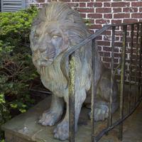 A Large Pair of Verdigris Cast Metal Seated Lions*