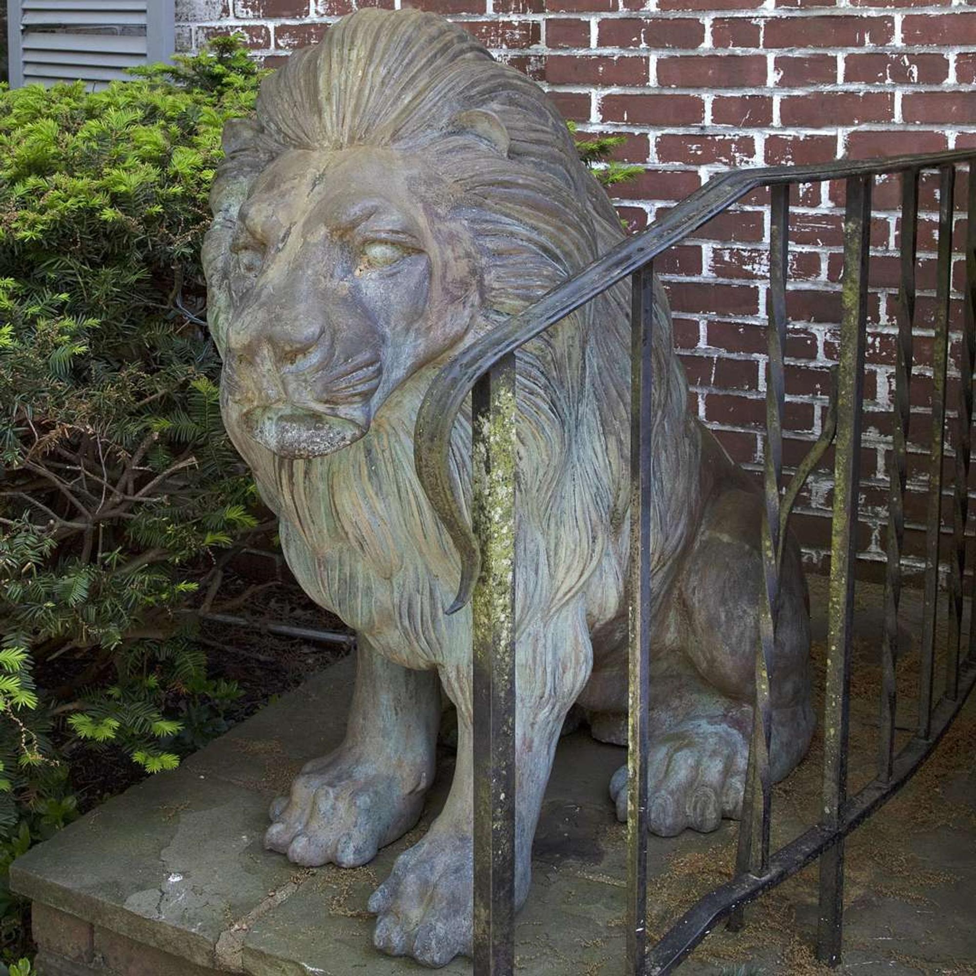A Large Pair of Verdigris Cast Metal Seated Lions*