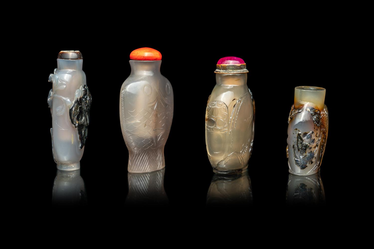 Four Chinese Carved Grey Agate Snuff Bottles