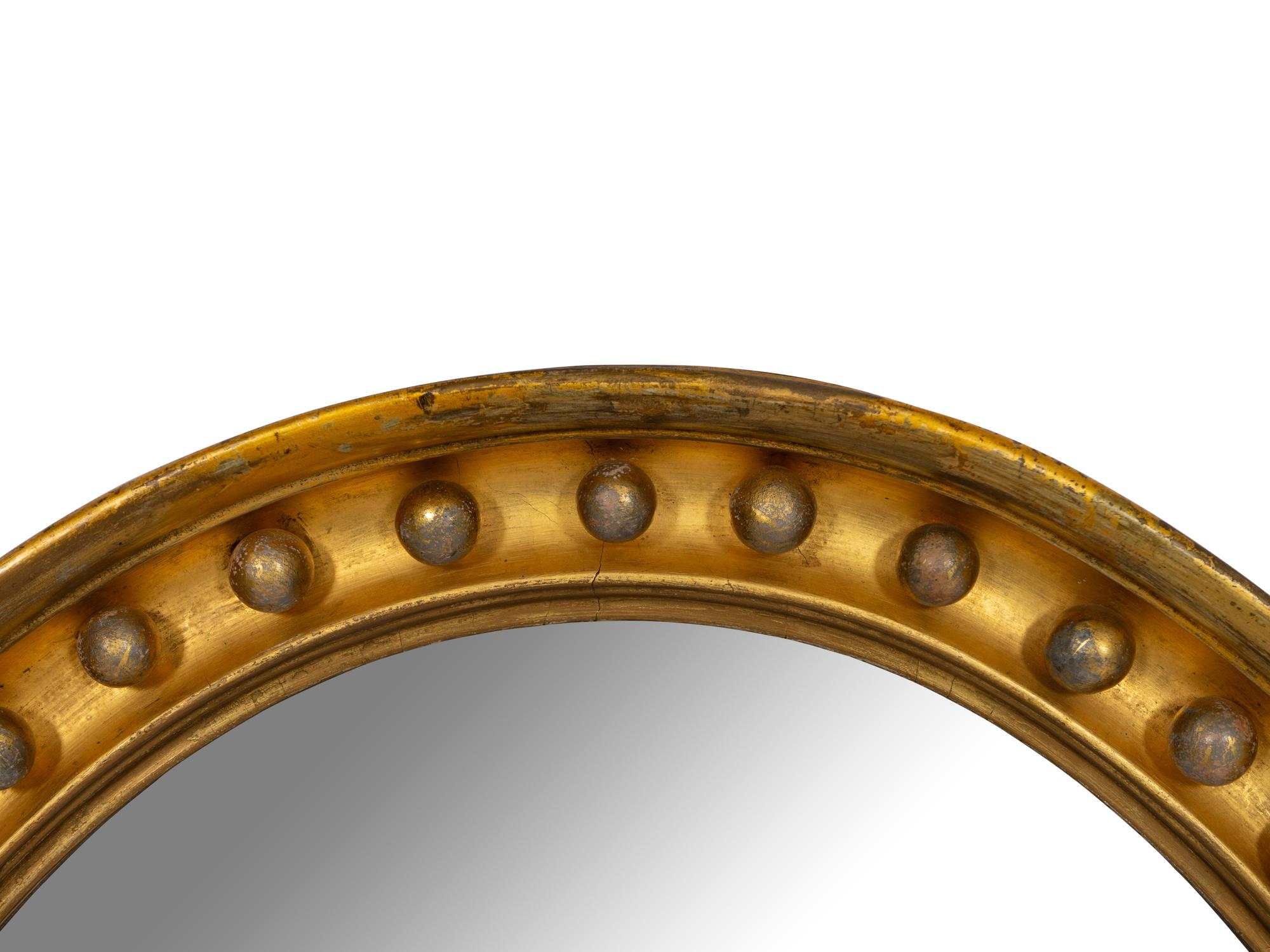 A Regency Style Oval Giltwood Mirror