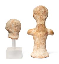 A Near Eastern Terracotta Figure and a Head