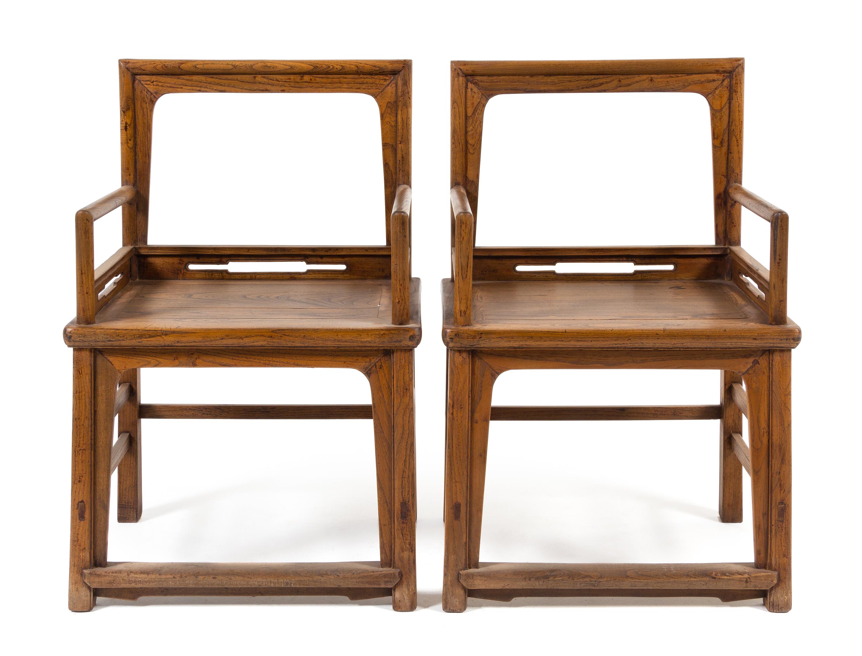 A Pair of Chinese Elmwood Armchairs, Meiguiyi Height 38 1/2 x width 25 x depth 18 1/8 inches. — QING DYNASTY (1644-1911)