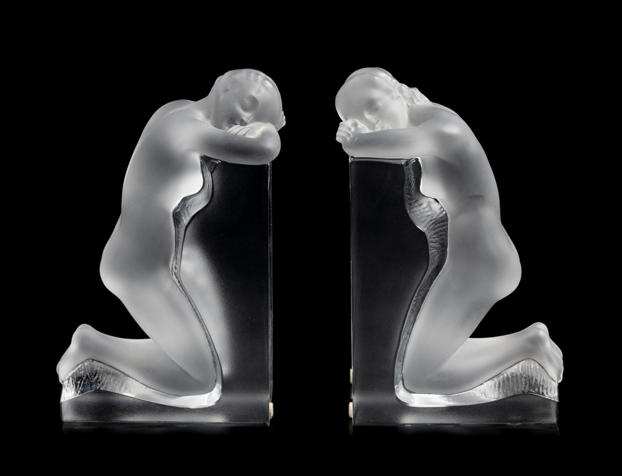 A Pair of Lalique Reverie Bookends Height 8 5/8 x width 5 1/4 x depth 2 inches