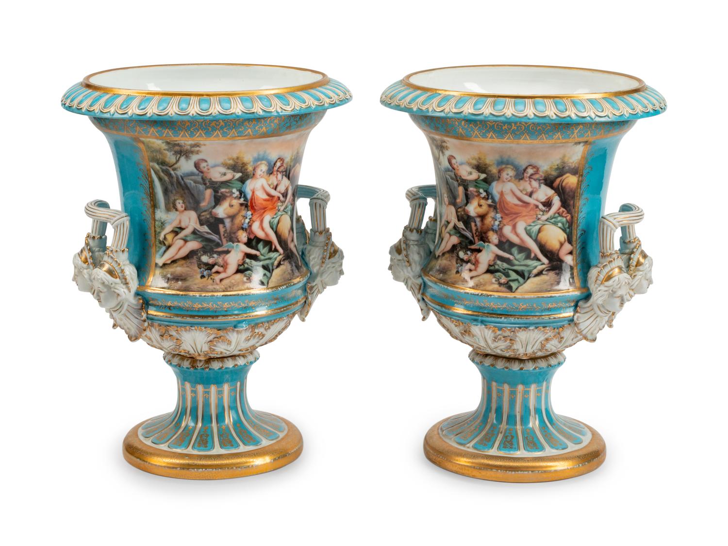 A Large Pair of Continental Porcelain Two-Handled Campana-Form Urns