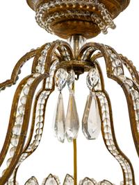An Italian Beaded Gilt Metal Six-Light Chandelier with a Rope Canopy