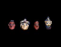 Four Phoenician Polychrome Glass Face Beads