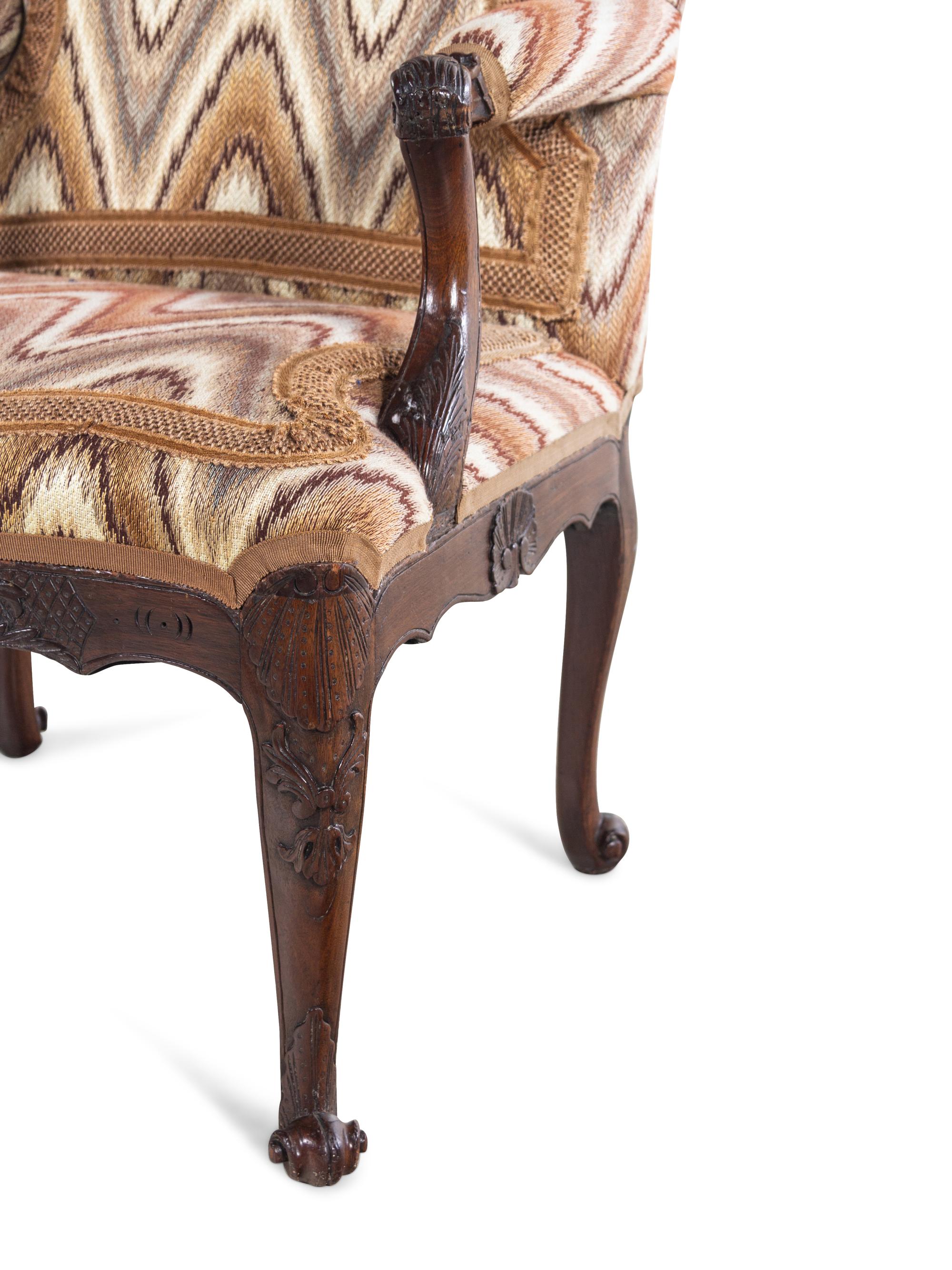 A Régence Style Carved Walnut Fauteuil